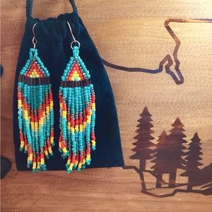 Boho style hanging beaded tassel earrings.